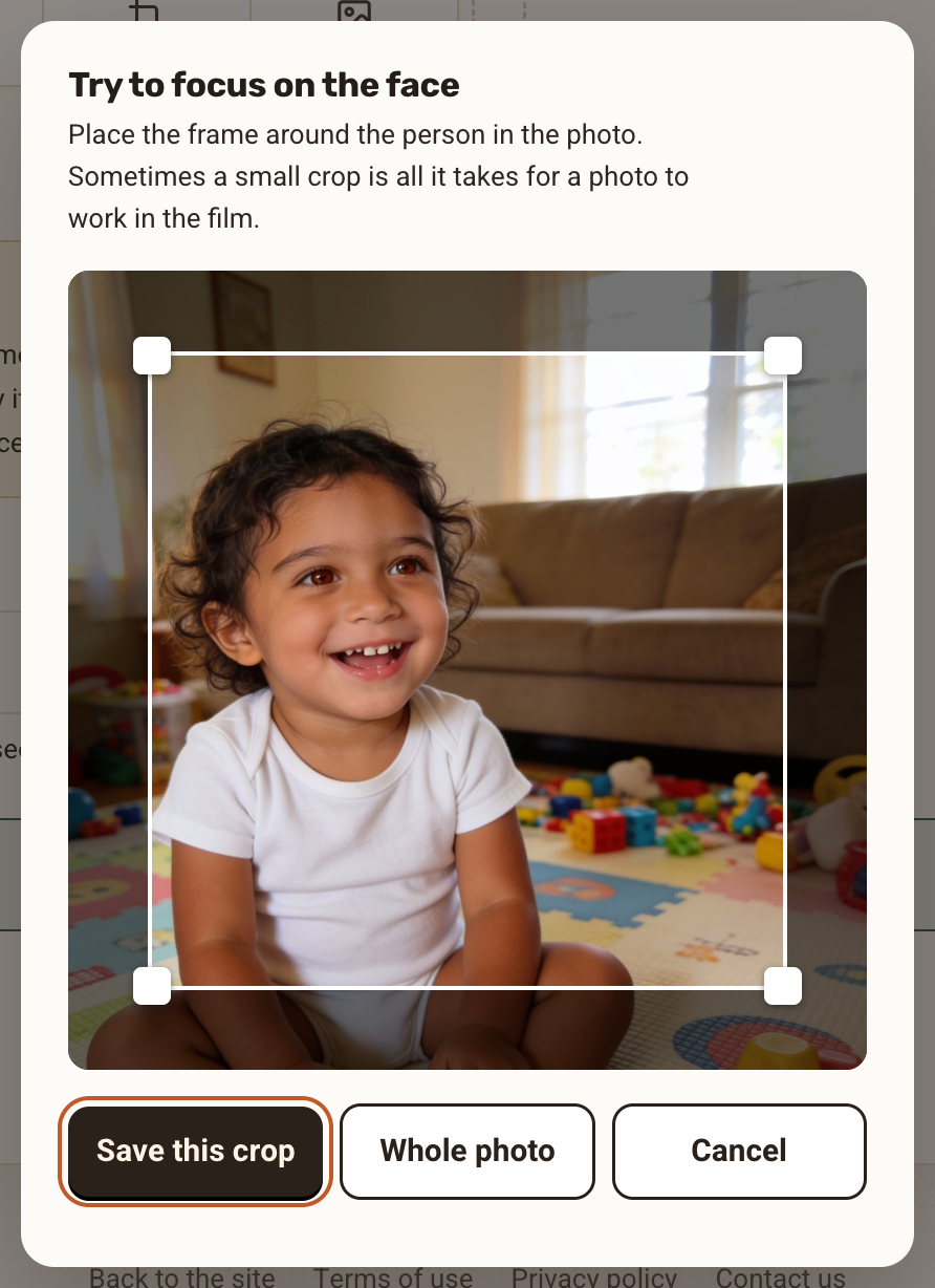 The crop window "Try to focus on the face", with a frame around the person and the buttons Save this crop, Whole photo and Cancel